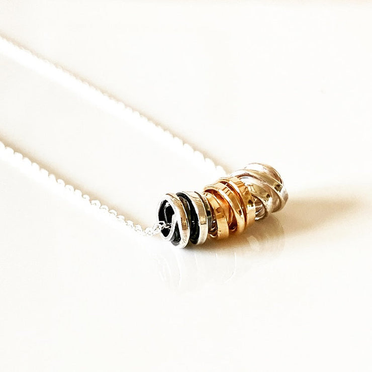 Tiny Kindred Coils on silver chain